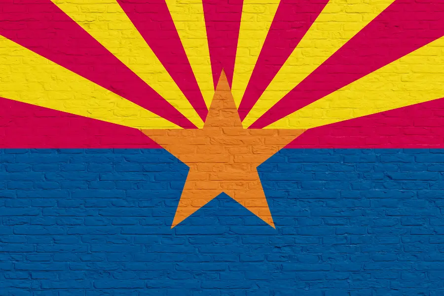 Arizona flag colors painted on a brick wall